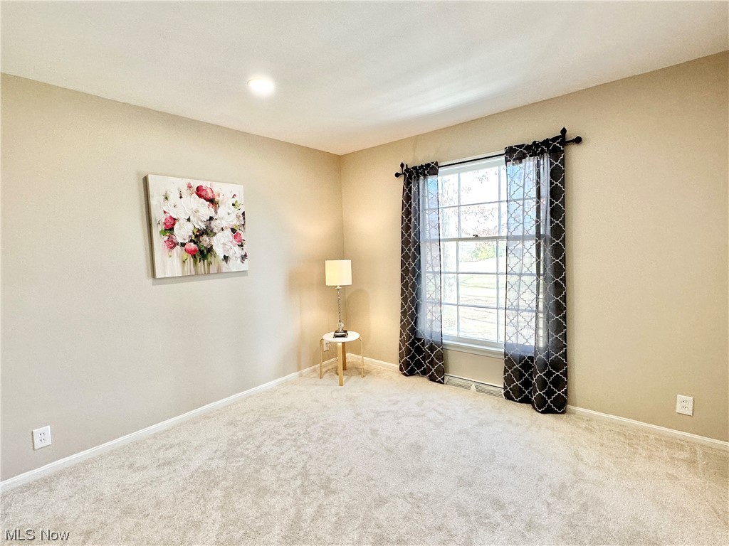 6130 Renninger Road New Franklin, OH 44319 - Photo 14 of 30 Bedroom #2 with a wealth of natural light, & recessed lighting and light carpet