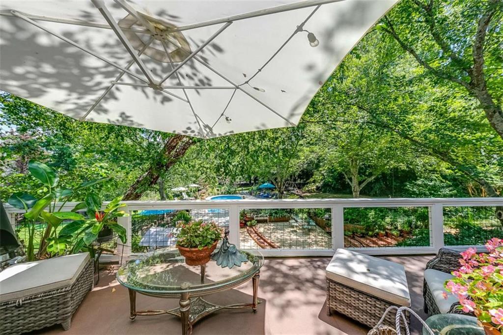 6180 Old Jefferson Road Athens, GA 30607 - Photo 21 of 95 a view of a patio with couches table and chairs and potted plants