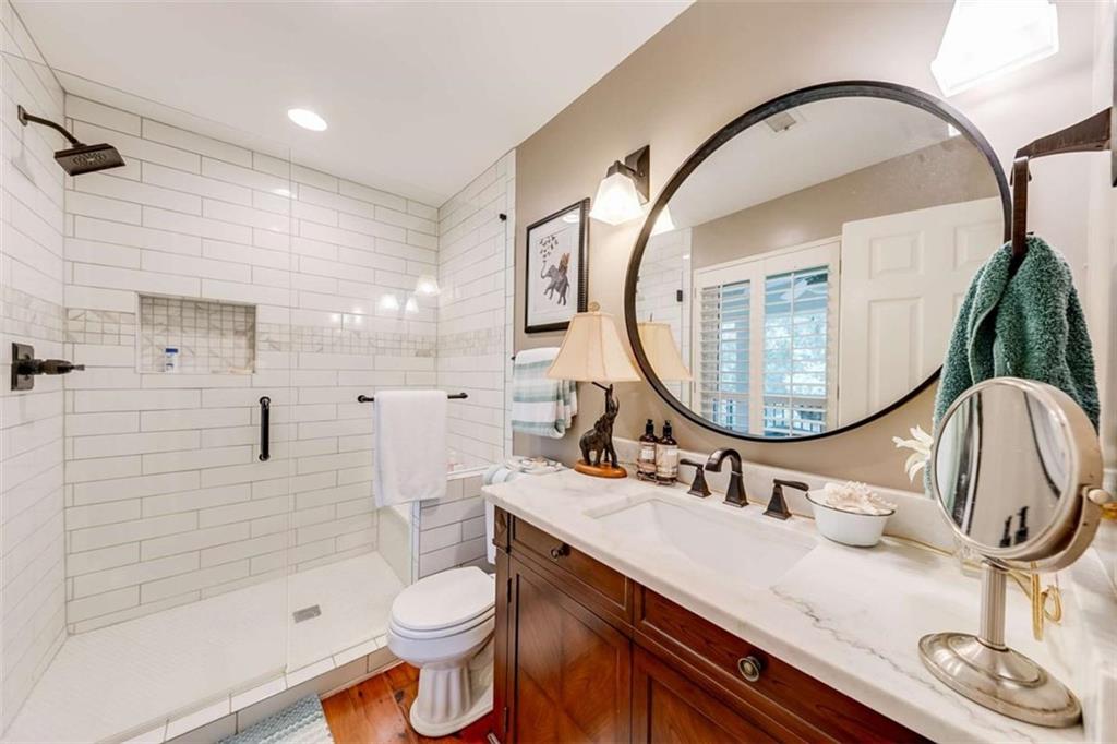 6180 Old Jefferson Road Athens, GA 30607 - Photo 51 of 95 a bathroom with a sink a toilet and a mirror