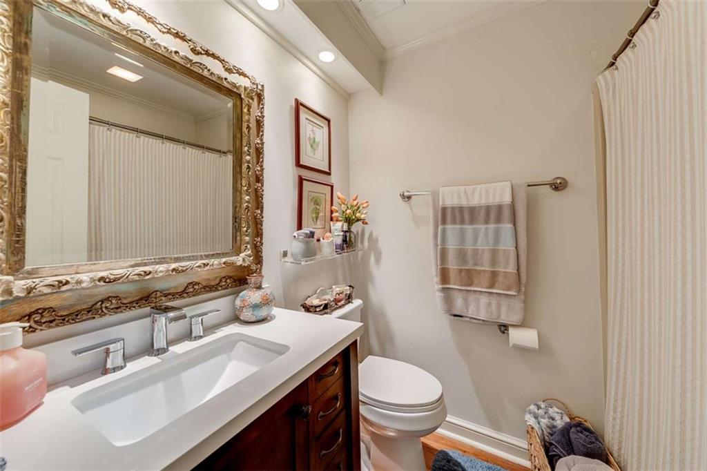 6180 Old Jefferson Road Athens, GA 30607 - Photo 54 of 95 a bathroom with a sink toilet a mirror and shower