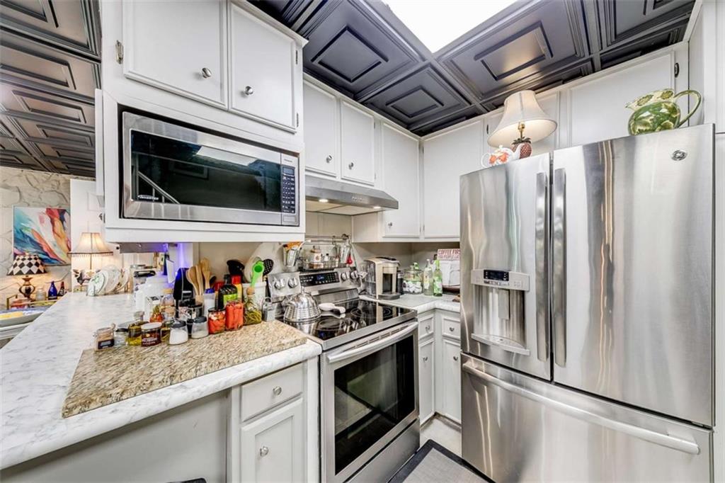 6180 Old Jefferson Road Athens, GA 30607 - Photo 65 of 95 a kitchen with stainless steel appliances a stove microwave and refrigerator