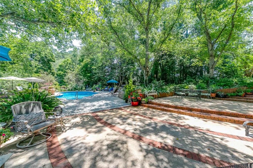 6180 Old Jefferson Road Athens, GA 30607 - Photo 75 of 95 a view of a park with a bench and some trees