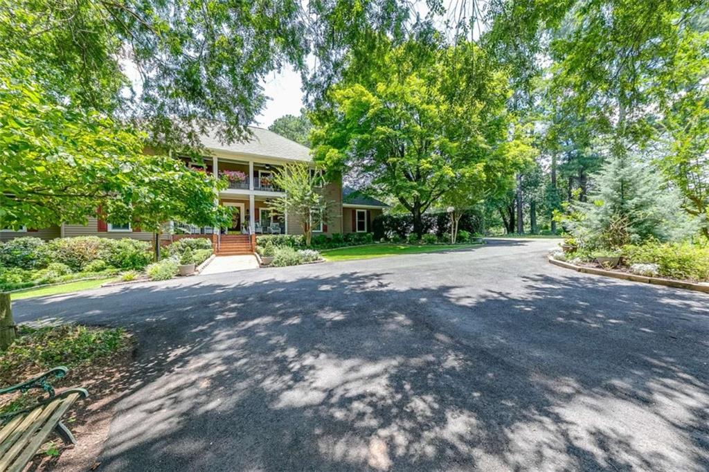 6180 Old Jefferson Road Athens, GA 30607 - Photo 8 of 95 a view of a house with backyard and trees