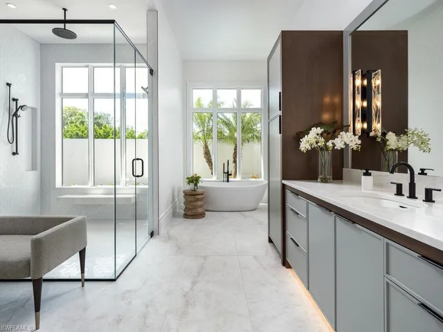 a spacious bathroom with a double vanity sink and a mirror
