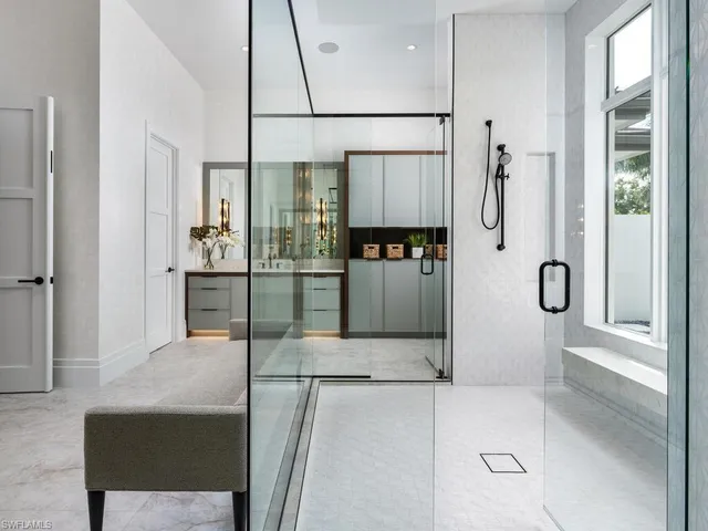 a bathroom with a glass shower door
