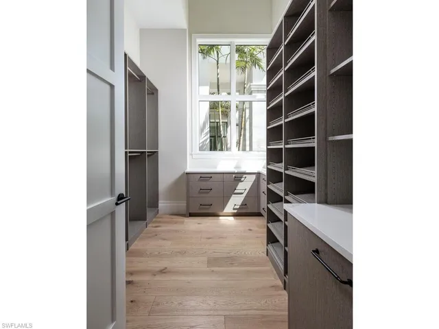 a kitchen with a refrigerator and window