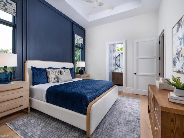a bathroom with a sink a mirror and a shower