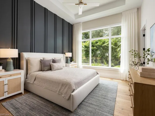 a bathroom with a double vanity sink toilet mirror and shower