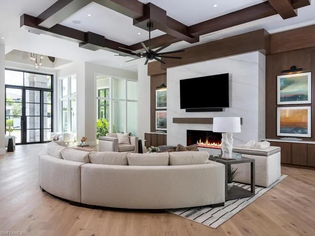 a living room with fireplace furniture and a flat screen tv