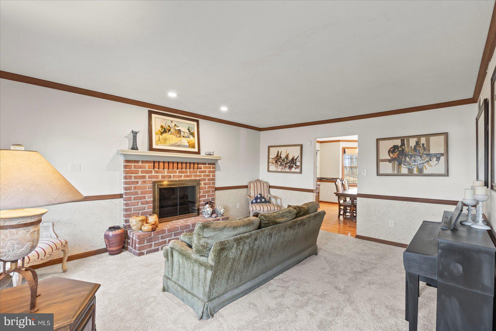 437 Valley View Drive Hanover, PA 17331 - Photo 16 of 40 a living room with furniture and a fireplace