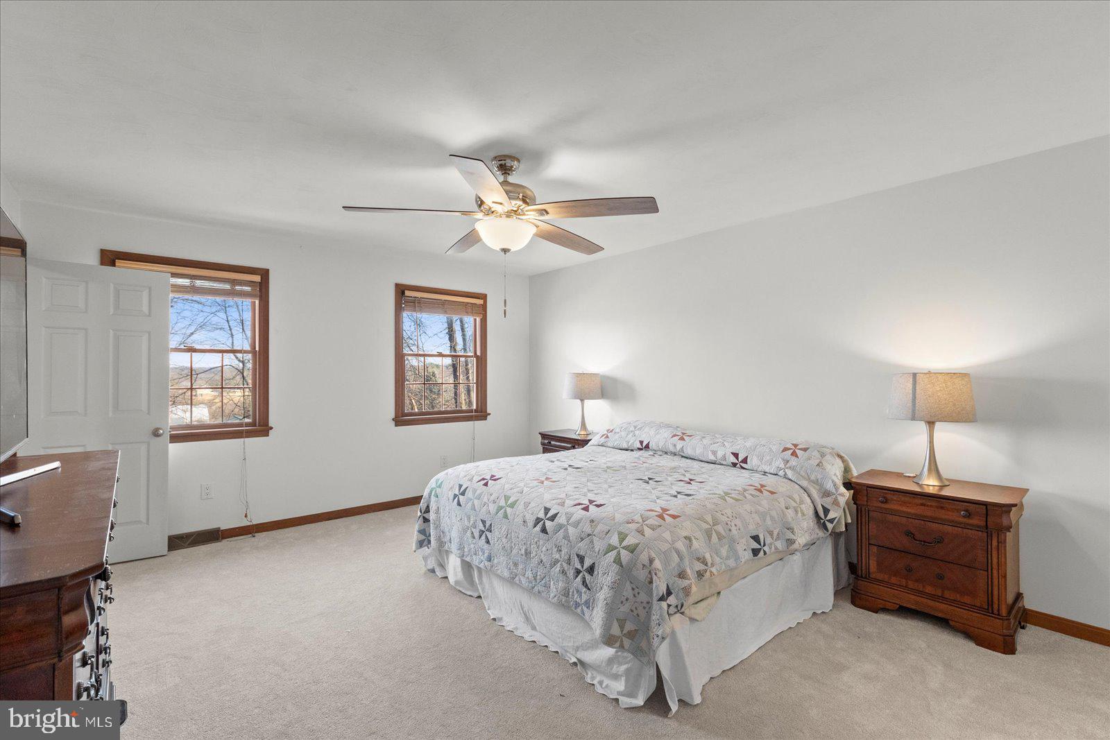 437 Valley View Drive Hanover, PA 17331 - Photo 19 of 40 a bedroom with a bed a chandelier and a window