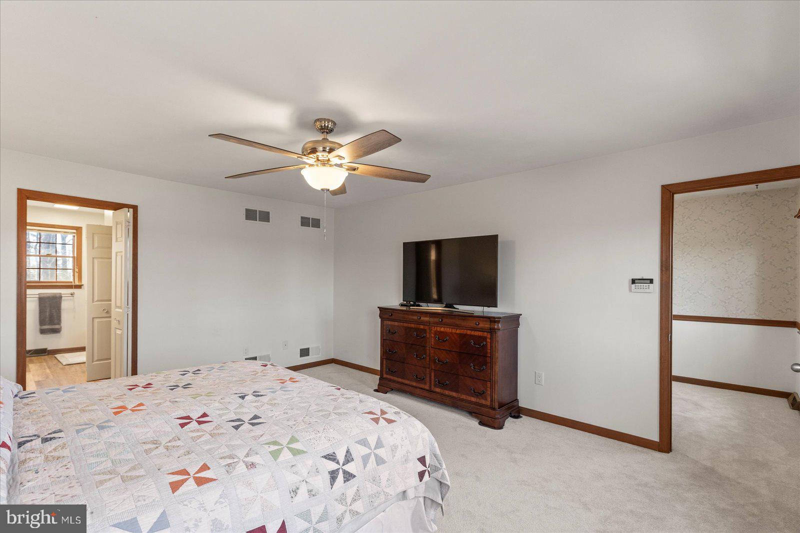 437 Valley View Drive Hanover, PA 17331 - Photo 20 of 40 a bedroom with a bed and a flat screen tv