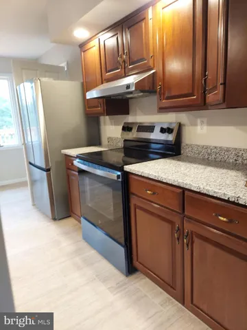 an empty room with an entrance to other room