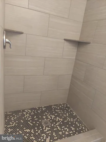 a bathroom with a toilet a sink and a mirror