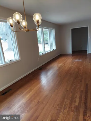a kitchen with stainless steel appliances granite countertop a sink a stove and cabinets