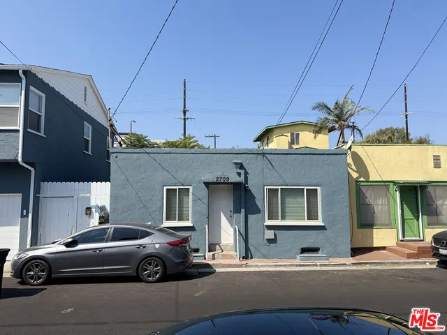 a view of a car parked in front of a building
