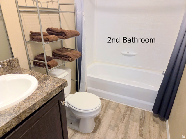 0 Nutter Avenue Thompson, UT 84540 - Photo 15 of 44 Full bathroom with vanity, light wood-style flooring, and shower / tub combo