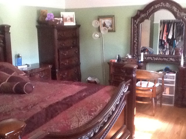 2132 Rugen Road, Unit C Glenview, IL 60026 - Photo 6 of 8 a bedroom with a bed and a chandelier