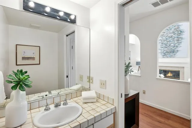 a bathroom with a sink and a mirror