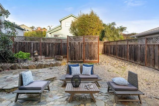 a view of a backyard with furniture