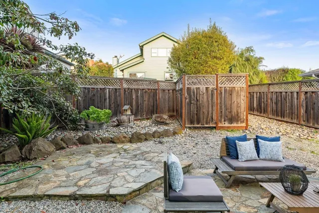 a view of a backyard with a patio