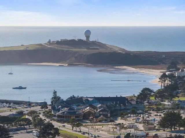 a view of ocean and mountain