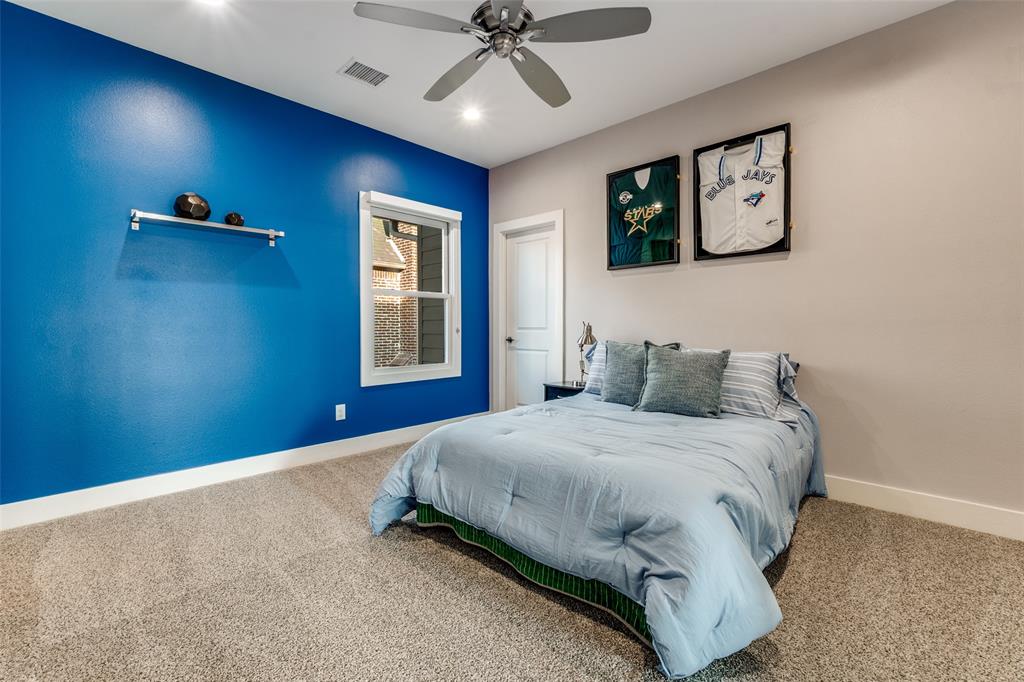 7912 Hanover Street Dallas, TX 75225 - Photo 14 of 29 Carpeted kid's room featuring a white single-hung window, a ceiling fan with integrated lighting, and a built-in wall shelf