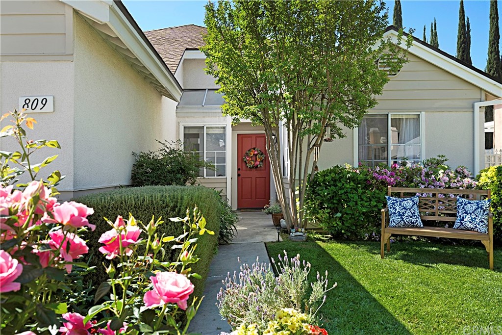 a front view of a house having a yard