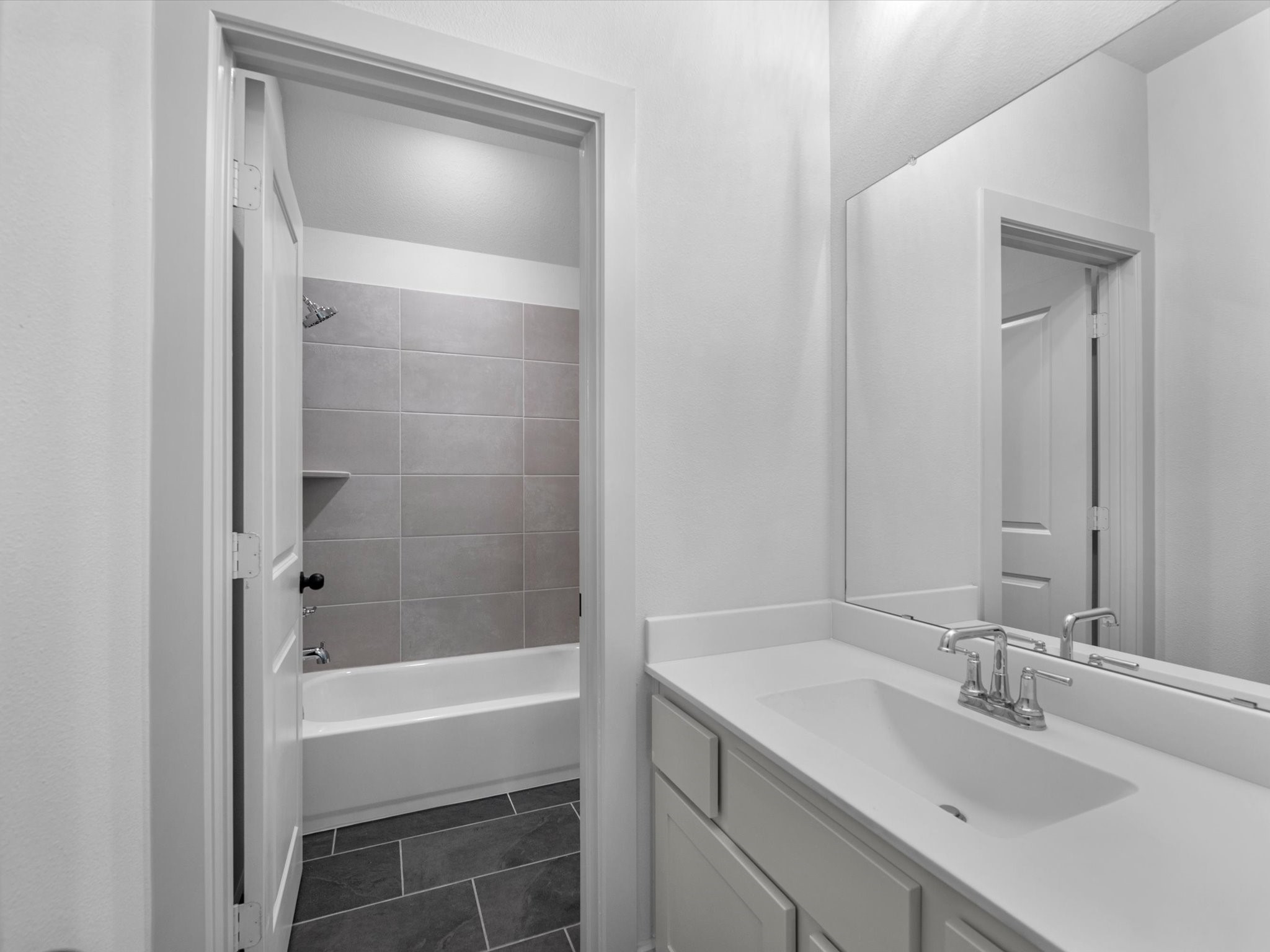 8915 Acropolis Lane Manvel, TX 77578 - Photo 23 of 32 a bathroom with a sink and a mirror