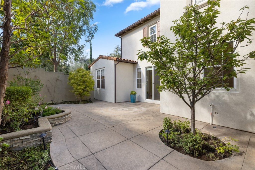 119 White Flower Irvine, CA 92603 - Photo 14 of 38 a front view of a house with garden