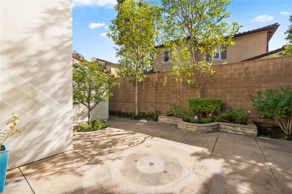 119 White Flower Irvine, CA 92603 - Photo 15 of 38 a view of a backyard with plants and large trees