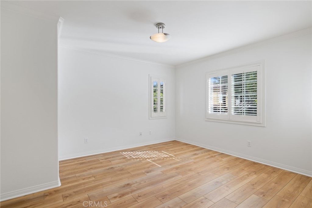 119 White Flower Irvine, CA 92603 - Photo 16 of 38 an empty room with wooden floor and windows