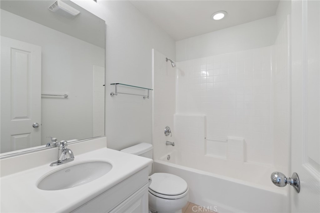 119 White Flower Irvine, CA 92603 - Photo 20 of 38 a bathroom with a sink toilet and shower