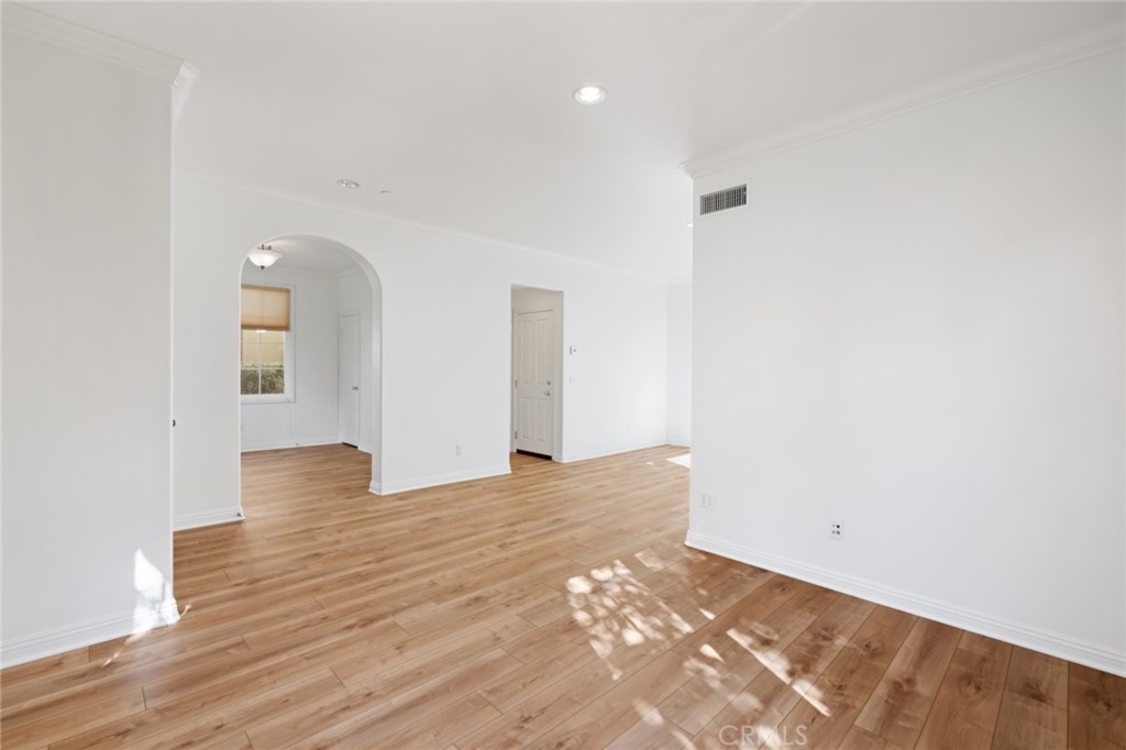 119 White Flower Irvine, CA 92603 - Photo 8 of 38 a view of a big room with wooden floor and windows