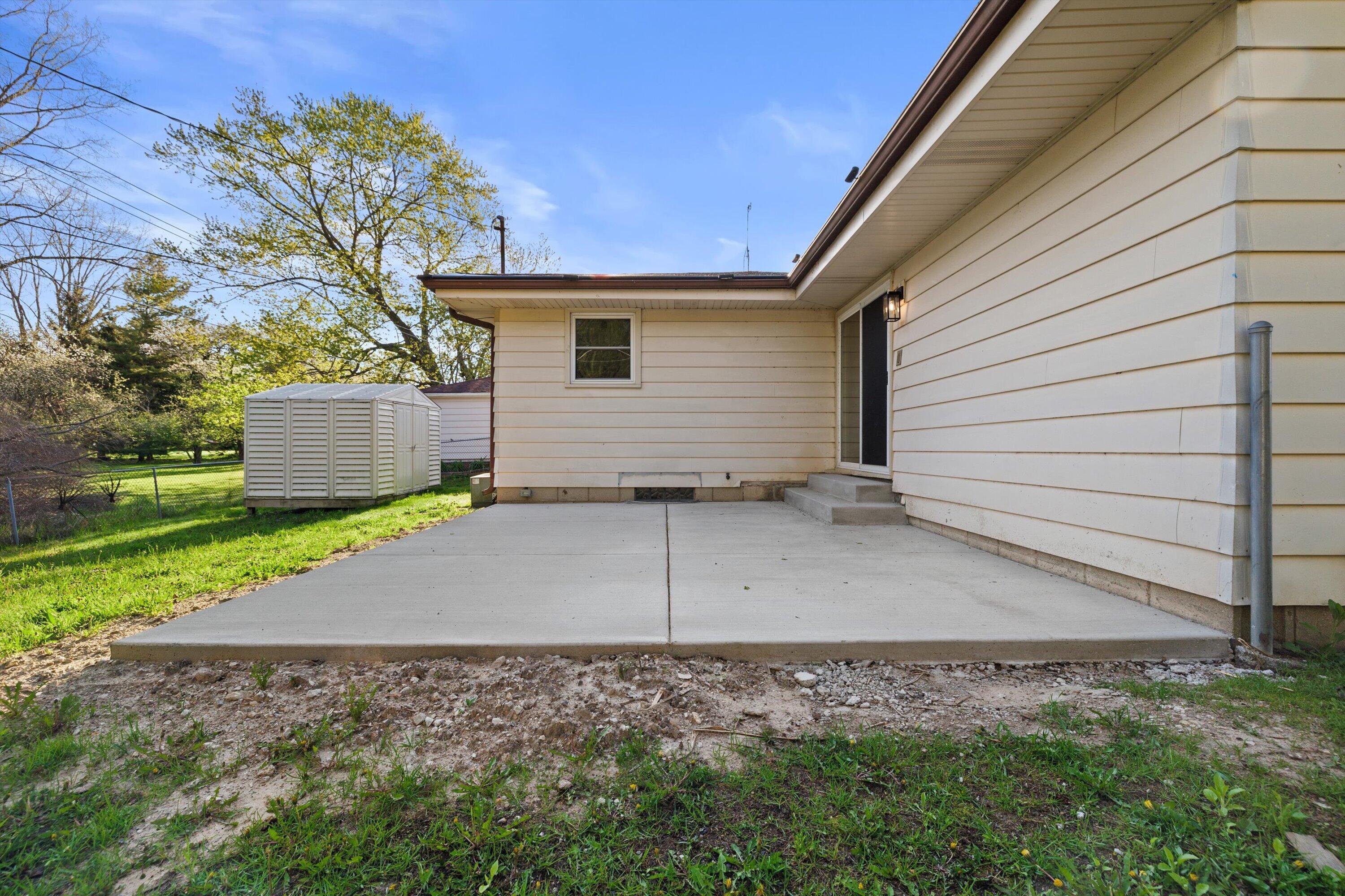 726 Royal Park Road Caledonia, WI 53402 - Photo 27 of 29 Concrete patio creates a perfect spot for outdoor seating, dining, and summer evenings