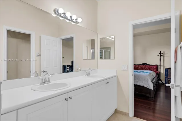 a bedroom with a bed and a mirror