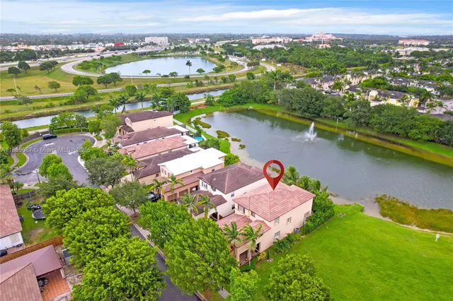 an aerial view of a house with a lake view
