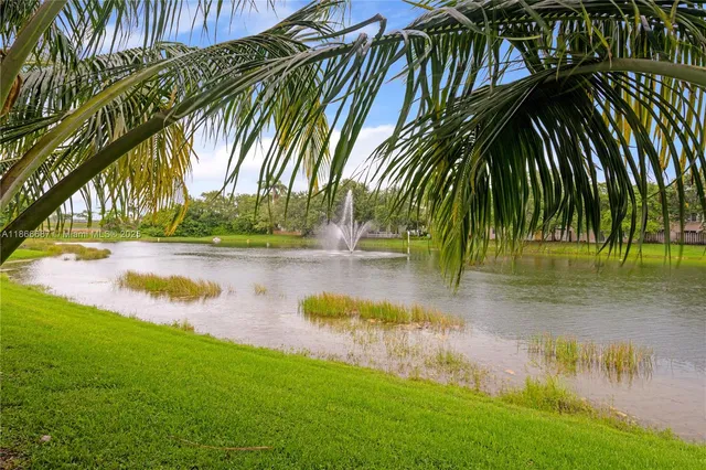 an aerial view of a house with a lake view