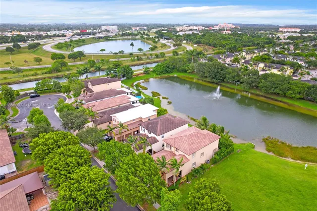 an aerial view of a house with a lake view