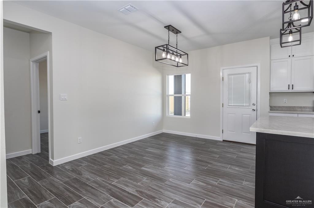 3559 Satelite Street Edinburg, TX 78542 - Photo 6 of 22 a view of empty room with wooden floor and window