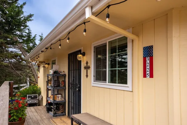 a bathroom with a granite countertop toilet sink and mirror