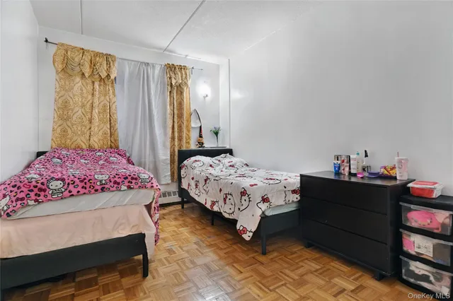 a bedroom with a bed and dresser