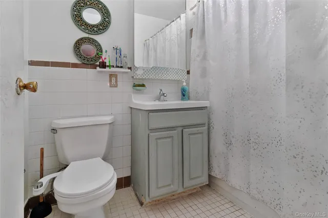 a bathroom with a toilet and a sink