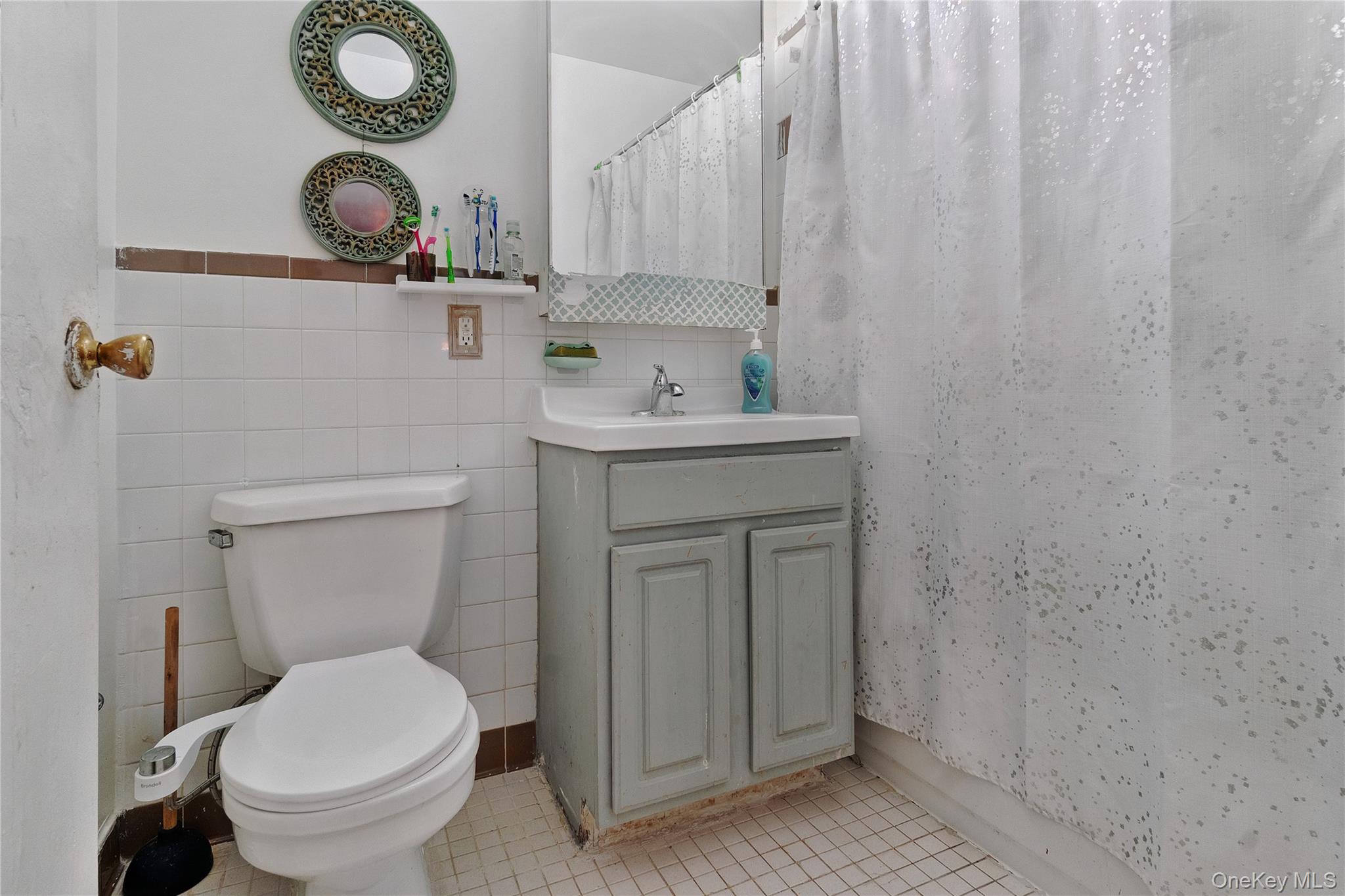 566 Gates Avenue, Unit 1B Brooklyn, NY 11221 - Photo 7 of 9 a bathroom with a toilet and a sink