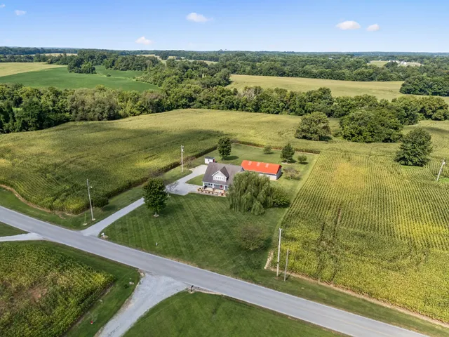 a kitchen with a refrigerator and a stove top oven