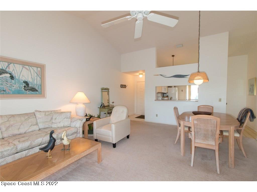 9640 Estuary Way, Unit 3 Sebastian, FL 32958 - Photo 11 of 24 a living room with furniture and a chandelier