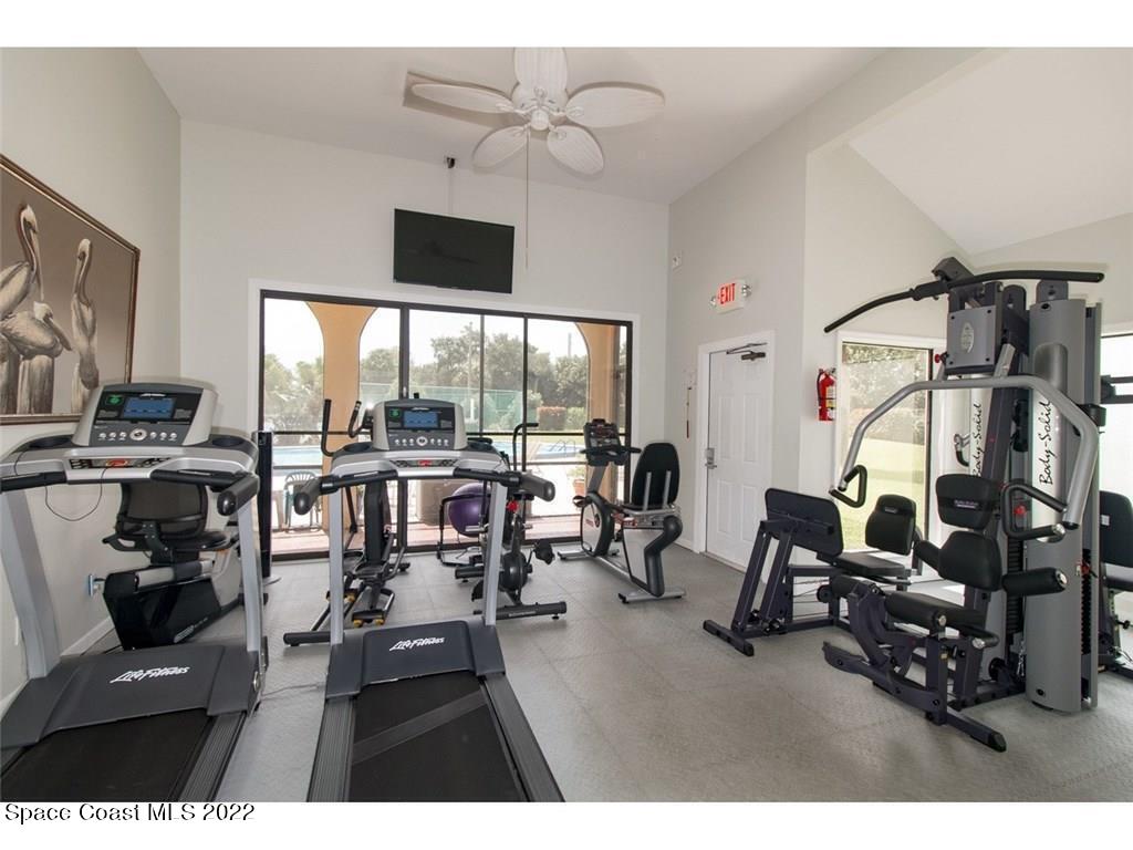9640 Estuary Way, Unit 3 Sebastian, FL 32958 - Photo 17 of 24 a living room with furniture and a flat screen tv