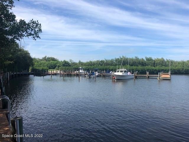 9640 Estuary Way, Unit 3 Sebastian, FL 32958 - Photo 22 of 24 a view of a lake with houses