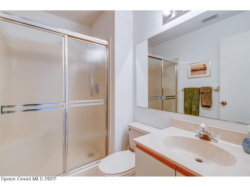9640 Estuary Way, Unit 3 Sebastian, FL 32958 - Photo 7 of 24 a bathroom with a sink and a mirror