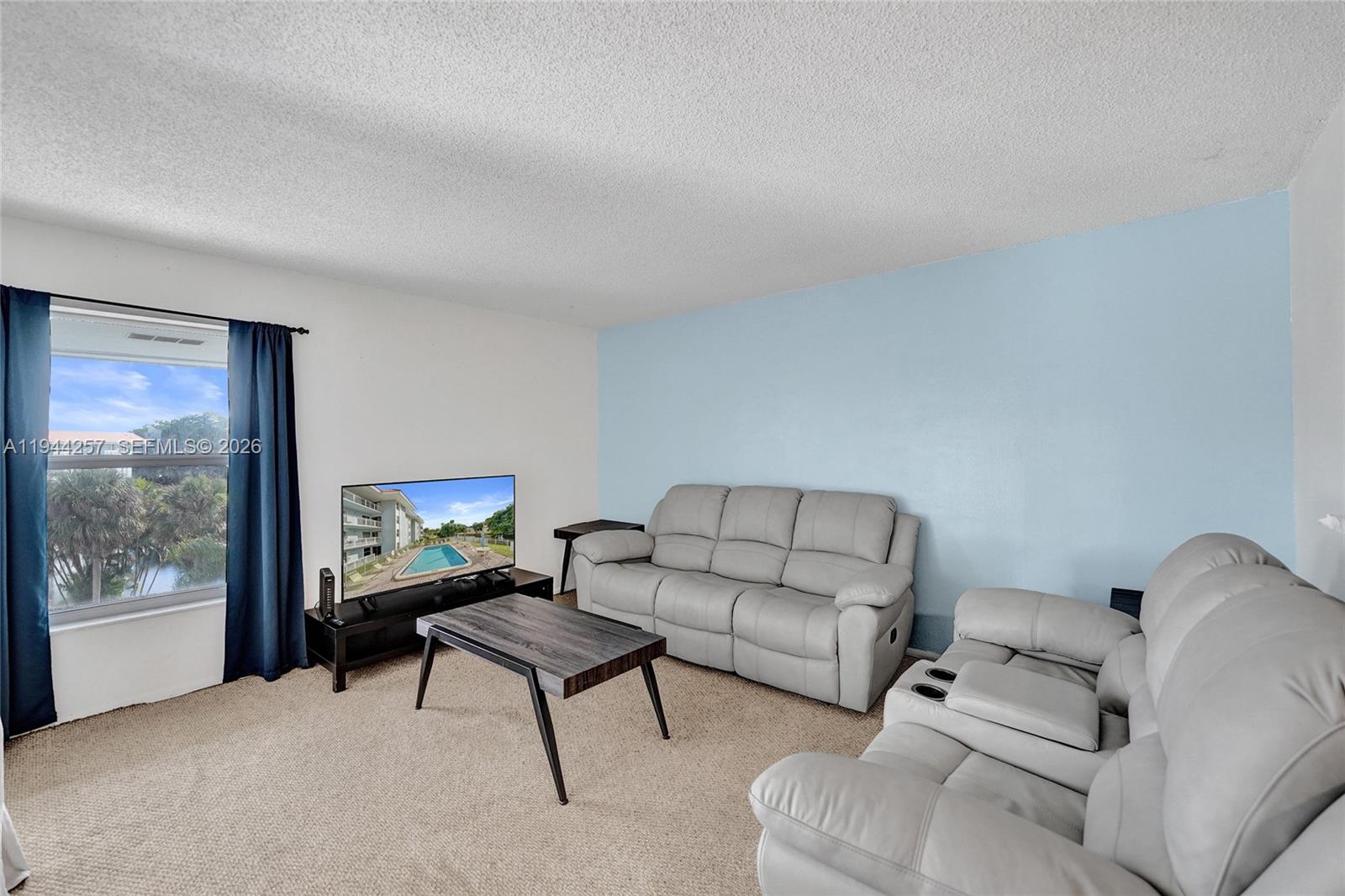 505 South Pine Island Road, Unit 405B Plantation, FL 33324 - Photo 11 of 43 a living room with furniture and a window